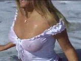 Busty blonde babe on beach