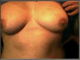 Busty babe showing her boobs