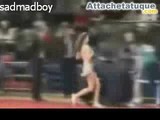 Cheerleader removes her top during a basketball game